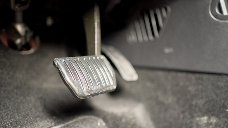 Ergonomically designed steel pedals with non-slip rubber surfaces of an automatic transmission car, gas pedal and brake pedal.