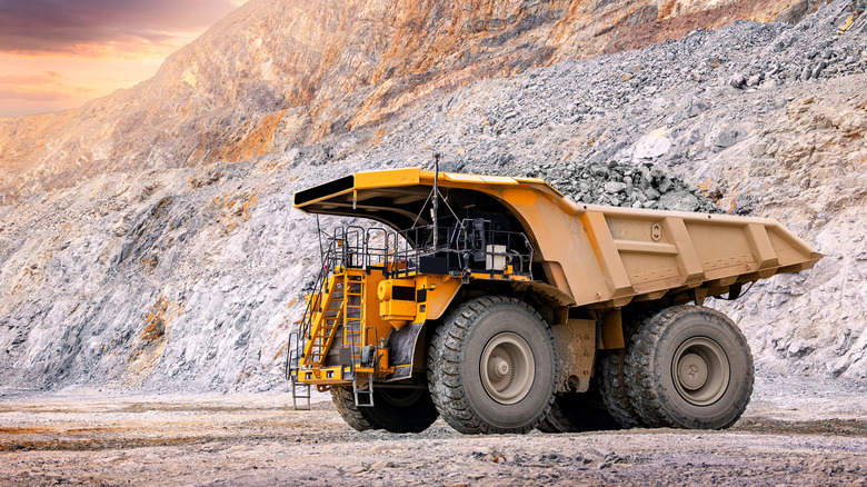 an industrial truck driving in a gold mine
