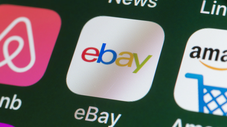 The buttons of the online shopping app ebay, surrounded by Airbnb, Amazon, News and other apps