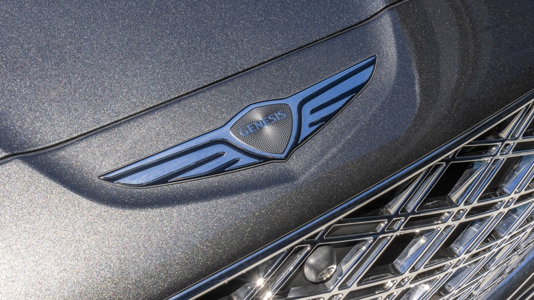 Genesis logo on the hood of a car