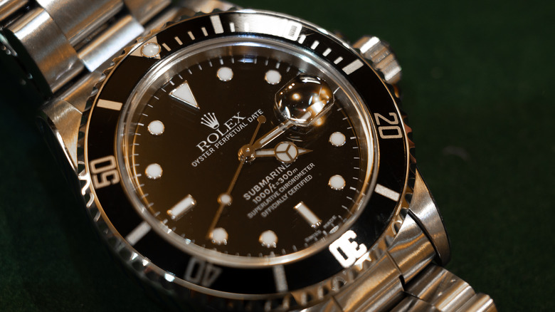 A second hand Rolex Oyster Perpetual Submariner Date watch is displayed for sale