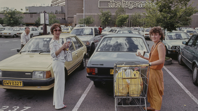 People in a parking lot at shopping center