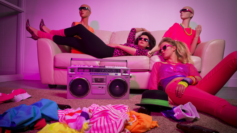 Women in 1980s gear with a boom box