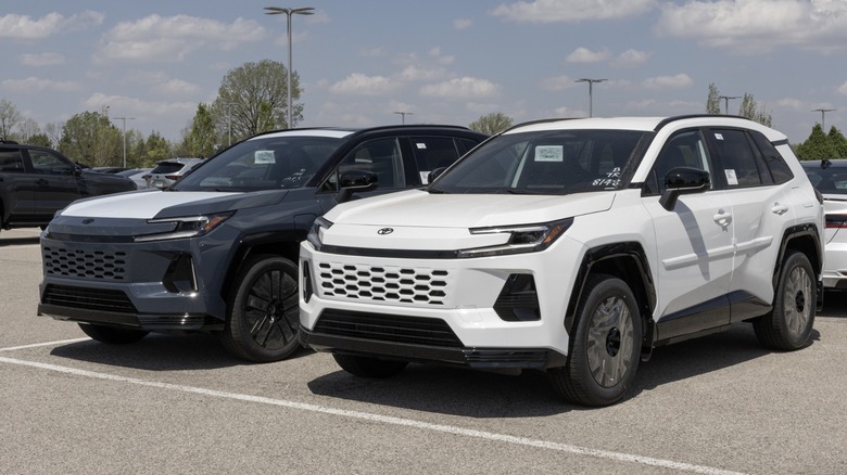 Two 2026 Toyota RAV4 SUVs parked side by side in a dealership lot