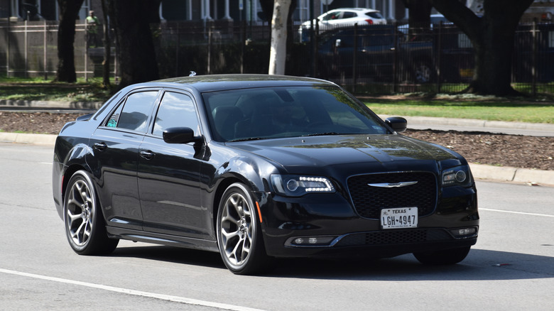 A black Chrysler 300 sedan on Allen Parkway in Houston