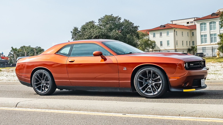 Wide angle side view of a 2023 Dodge Challenger RT Coupe at a local car show.