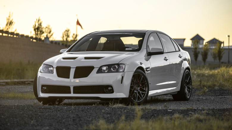 White Pontiac G8 parked at sunset.