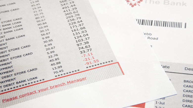 A bank statement showing an overdrawn account balance.