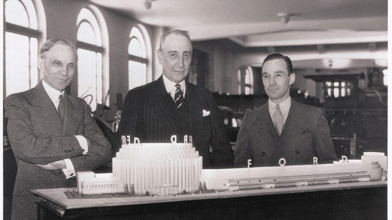 Henry Ford and Edsel Ford standing next to Rufus C. Dawes, president of the World's Fair.