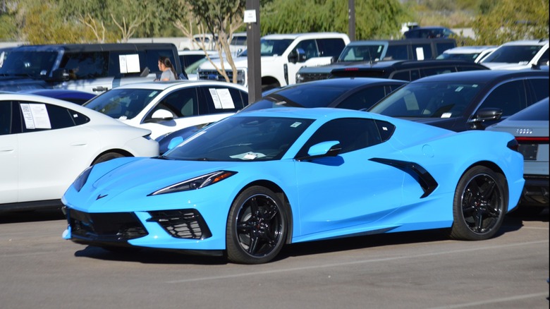 Blue Chevrolet Corvette Stingray parked in a dealership