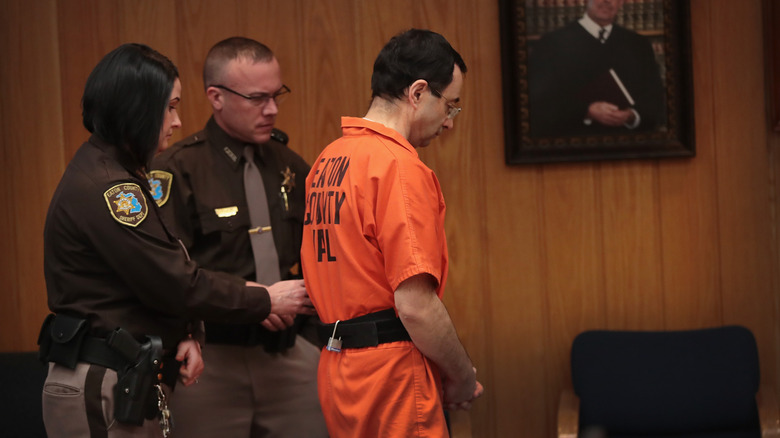 Larry Nasser being led away in court