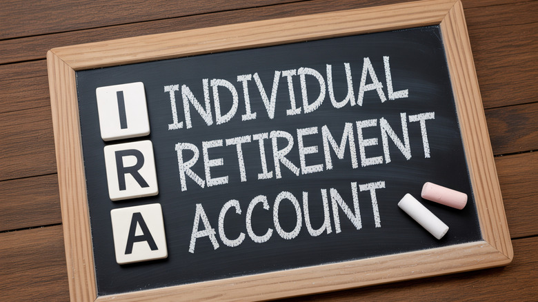 A chalkboard displays the words "Individual Retirement Account" and the acronym "IRA".