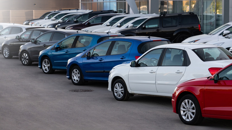 A row of cars for sale at dealership