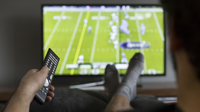 Man watching football on TV