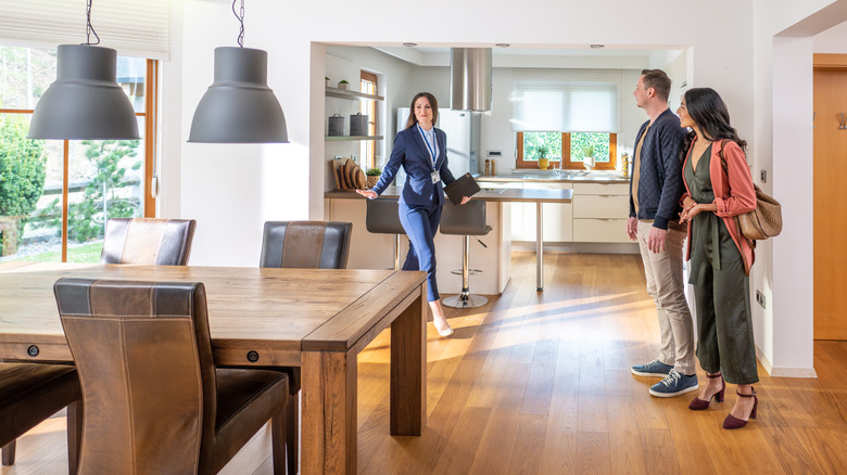 real estate agent showing a house