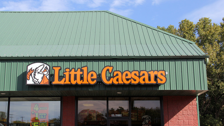 The exterior of a Little Caesars pizza restaurant.