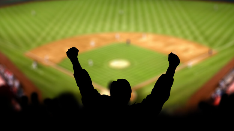 Fans lifting hand at stadium