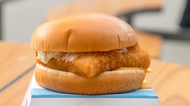 McDonald's Filet-O-Fish sandwich placed on top of its box