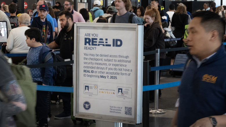 Sign at airport reminding passengers of new regulations regarding Real ID requirements.