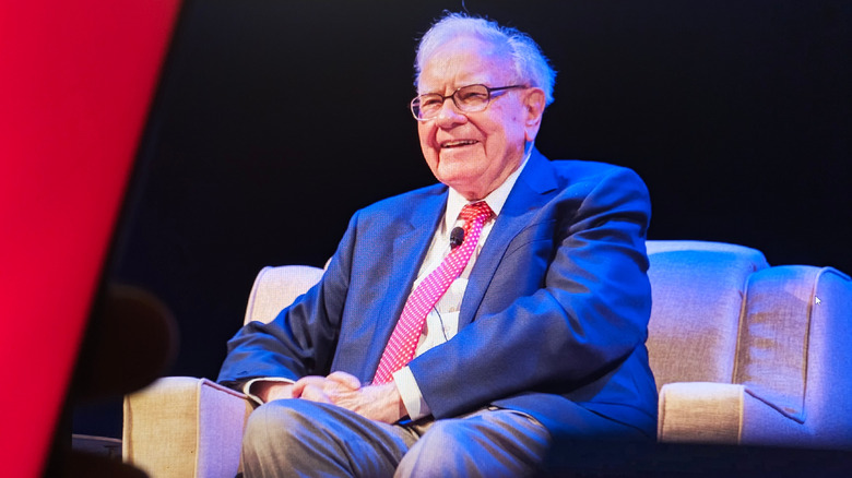 Warren Buffett sitting on a stage
