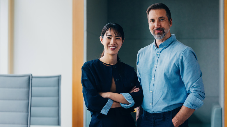 Man and women in office.