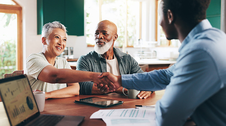 Elderly couple meeting with a financial planner