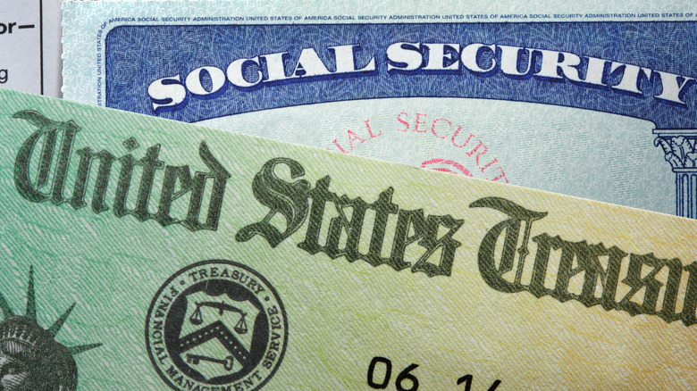 Social Security card and currency stacked together