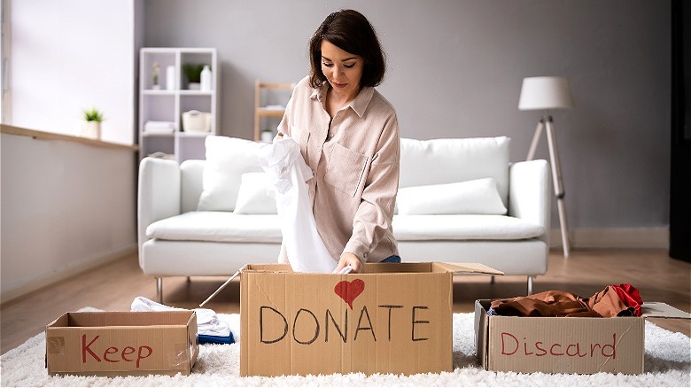 Person sorting clothes for donation