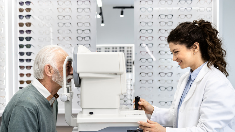 An elderly man receiving a vision test