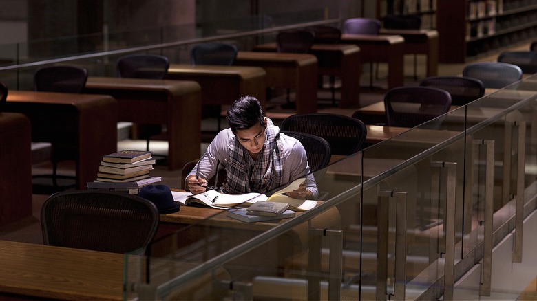 Student studying in empty library