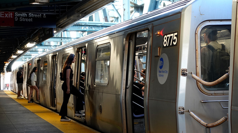 People boarding a subway train in New York City