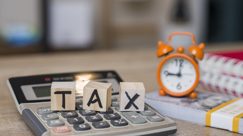 tax spelled in blocks on a calculator