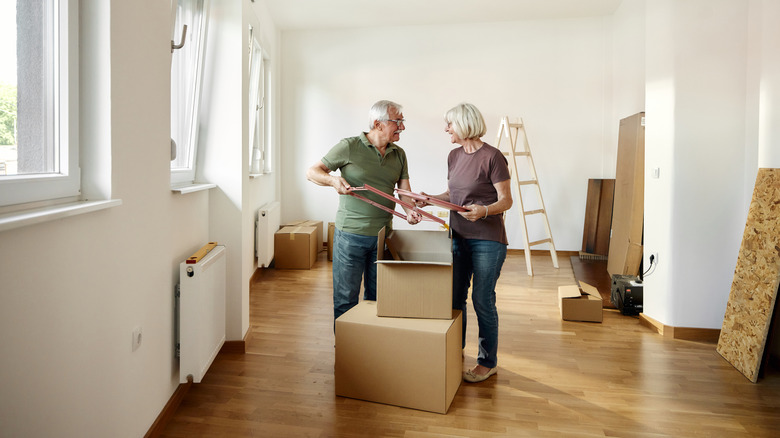Boomers unpacking belongings in new apartment