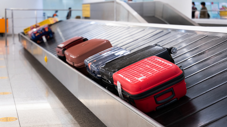 Different pieces of luggage on an airport carousel