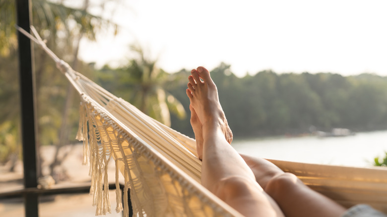 Person in hammock on beach