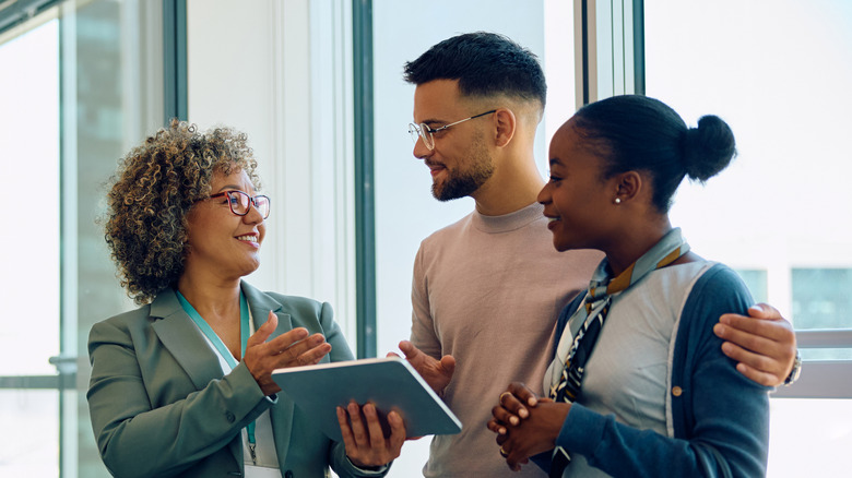 A financial advisor making plans with a young couple