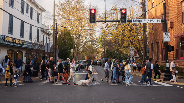 Pedestrians cross Main Street in New Hope, a popular travel destination