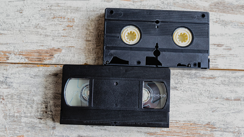 Two VHS tapes on a tabletop.