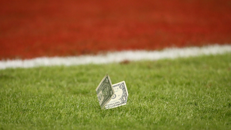 A U.S. dollar after it fell onto a football field