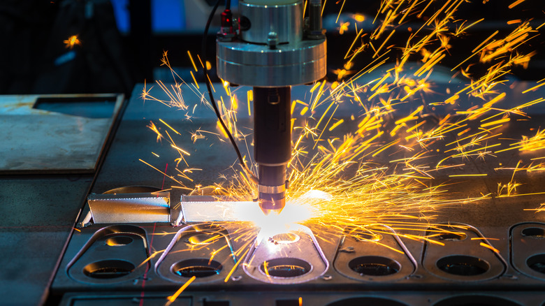 Sparks flying as lasers engrave metal