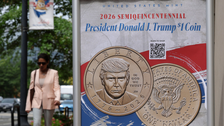 An outdoor sign displaying the Trump $1 Coin.