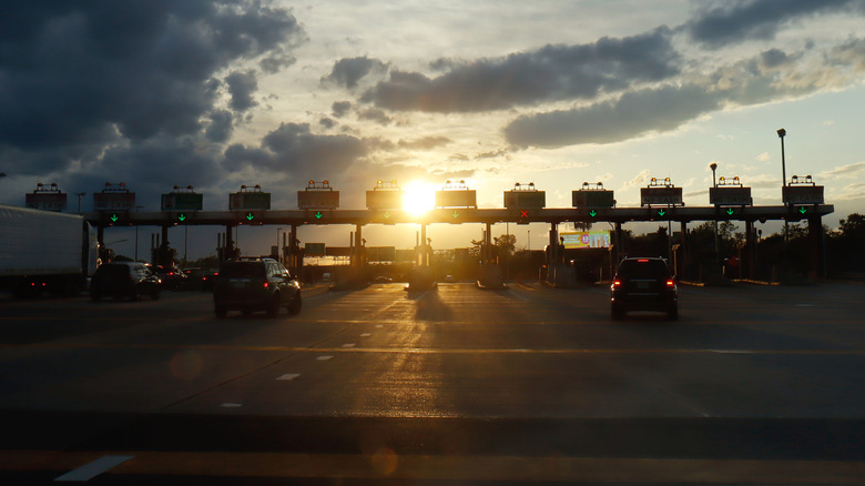 People driving through a toll road
