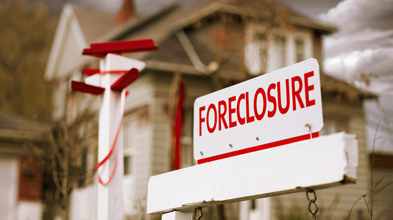 Foreclosure sign outside of house