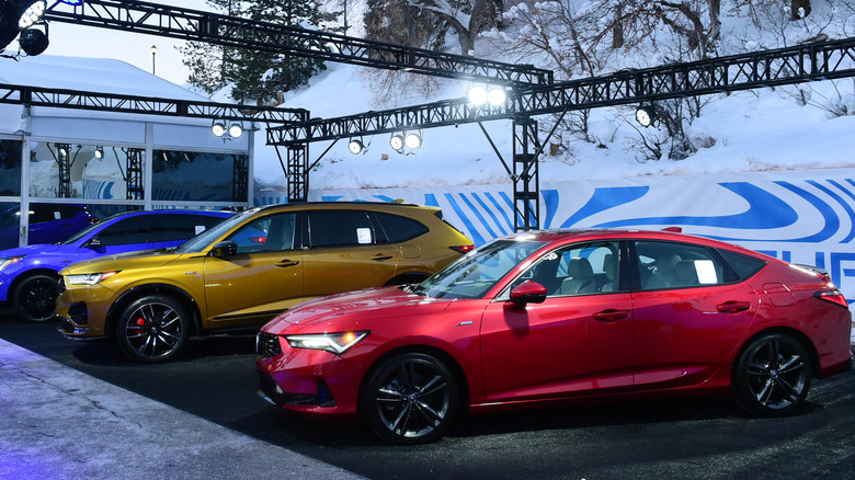 Blue, gold, and red 2023 Acura MDX vehicles displayed at the Sundance Film Festival.