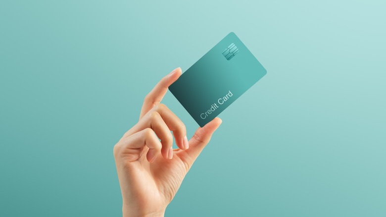 hand holding credit card