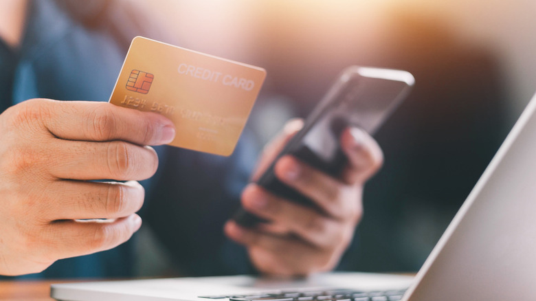 person holding a credit card