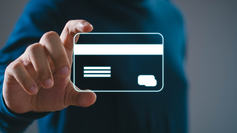 person holding image of virtual card