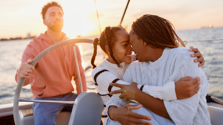 Family enjoying day on yacht