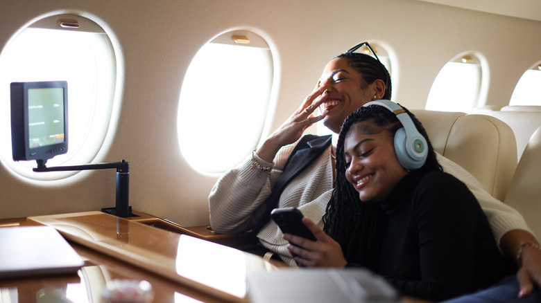 mother and daughter on a private plane