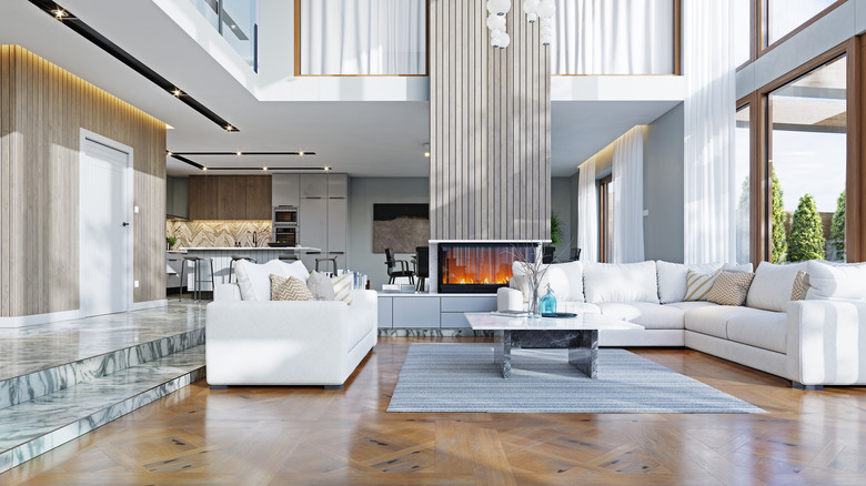 A white interior living room in a luxurious home under bright natural light.